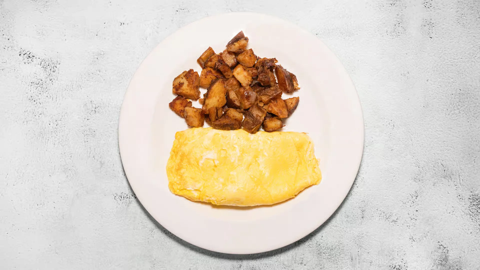 Cheese Omelet - Prepared with 3 eggs and shredded cheddar cheese