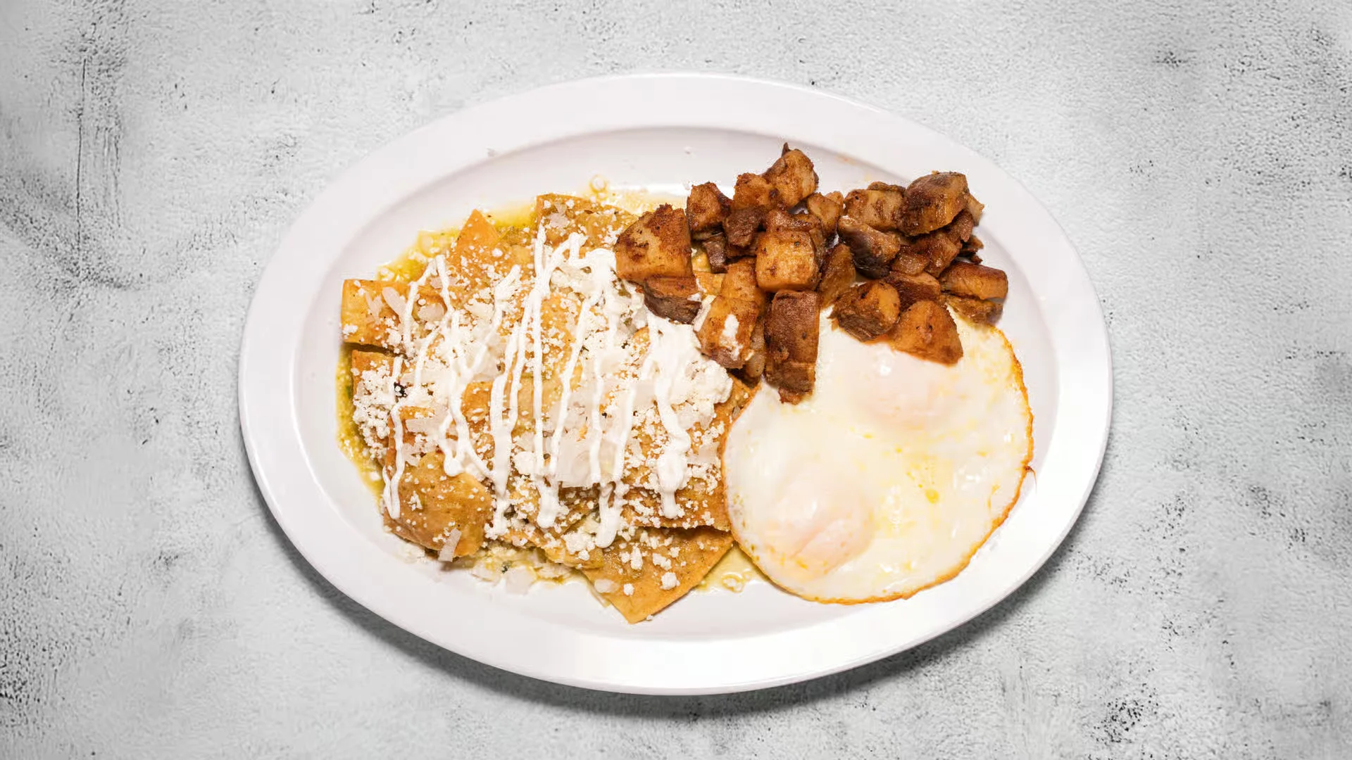 Chilaquiles with 2 Eggs - With choice of green or red salsa and home fries