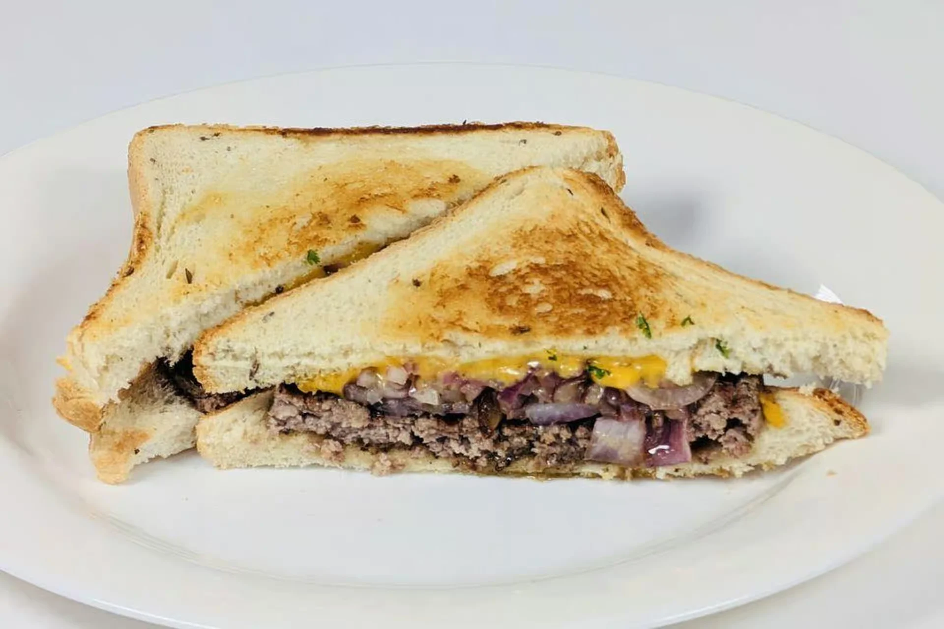 Patty Melt Burger - Grilled on rye with cheddar & grilled onions