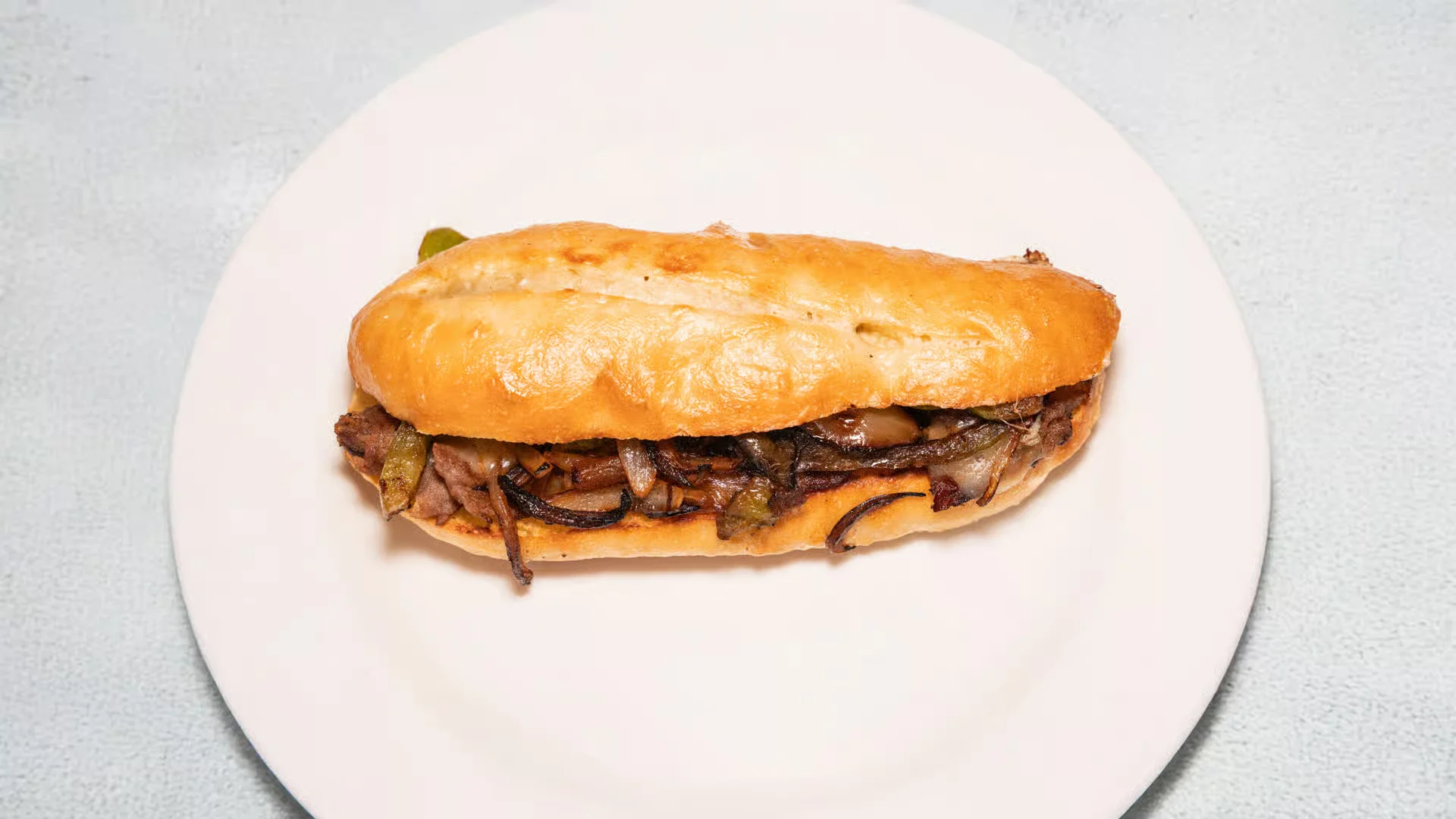 Philly Cheese Steak - With sauteed onions, bell pepper & cheese