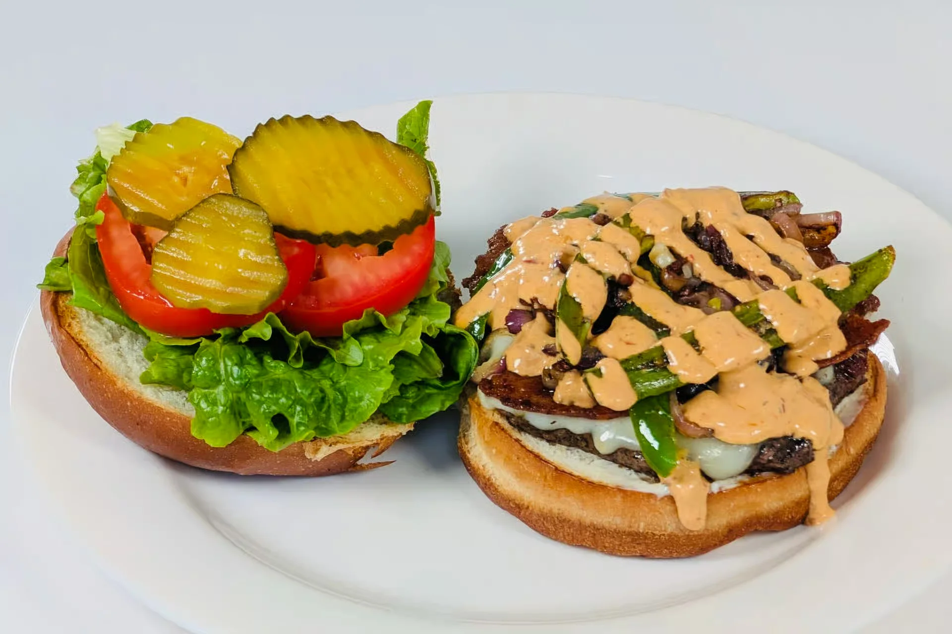 Super Caliente Burger - Bacon, pepper jack, grilled onions, fresh jalapenos, and our spicy house chipotle.